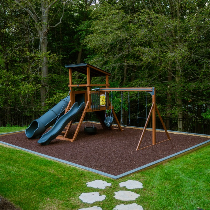 Swing set on a rubber mulch play area